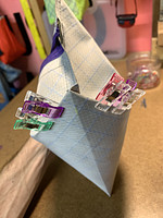 Corner popped out and side stitch lines lined up with center of bottom of bag