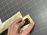 3/4" flap for binding, folded over at 3/8"-in, before folding one more time to create a double rolled hem.